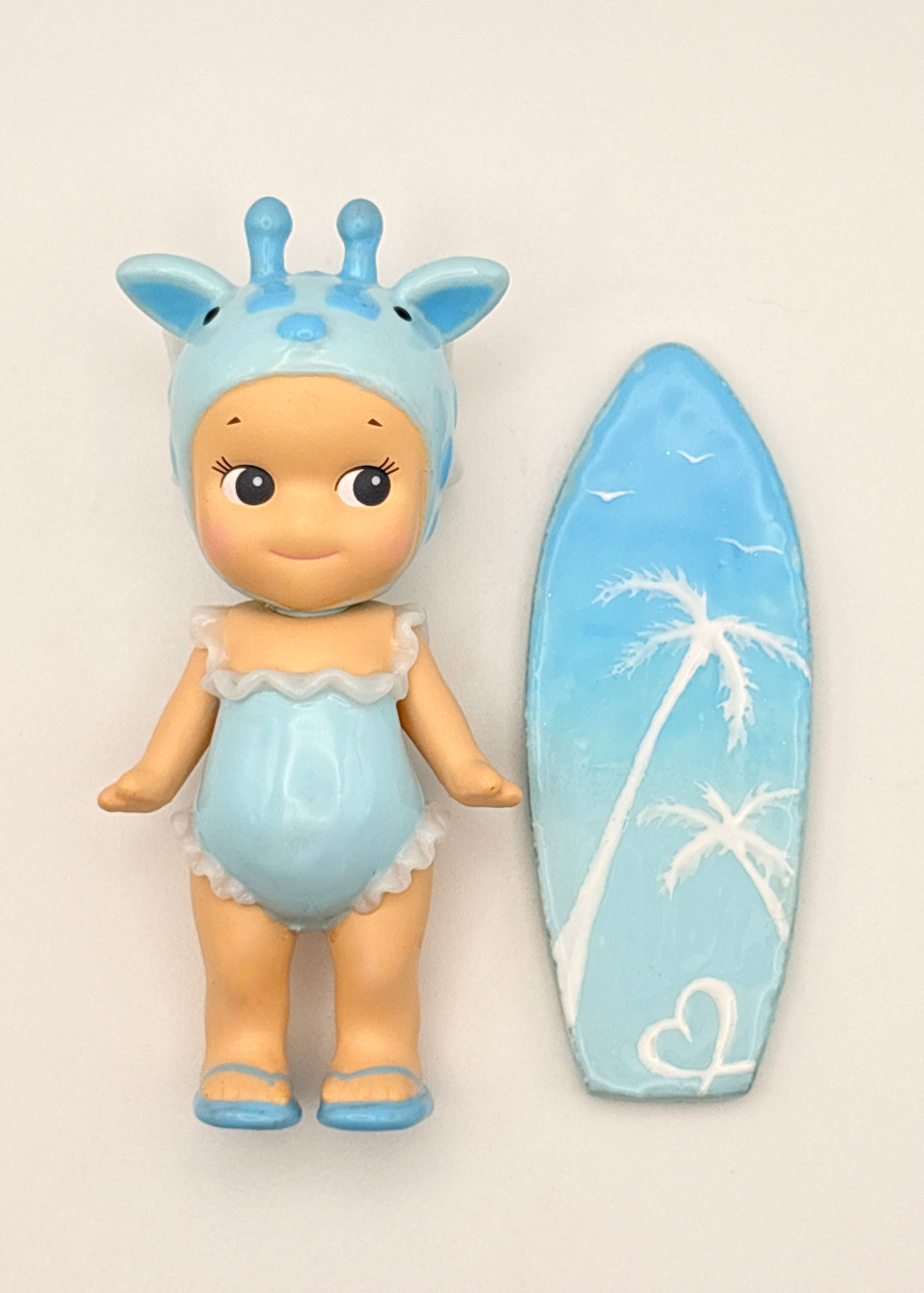 Blue Giraffe Surfer Figure