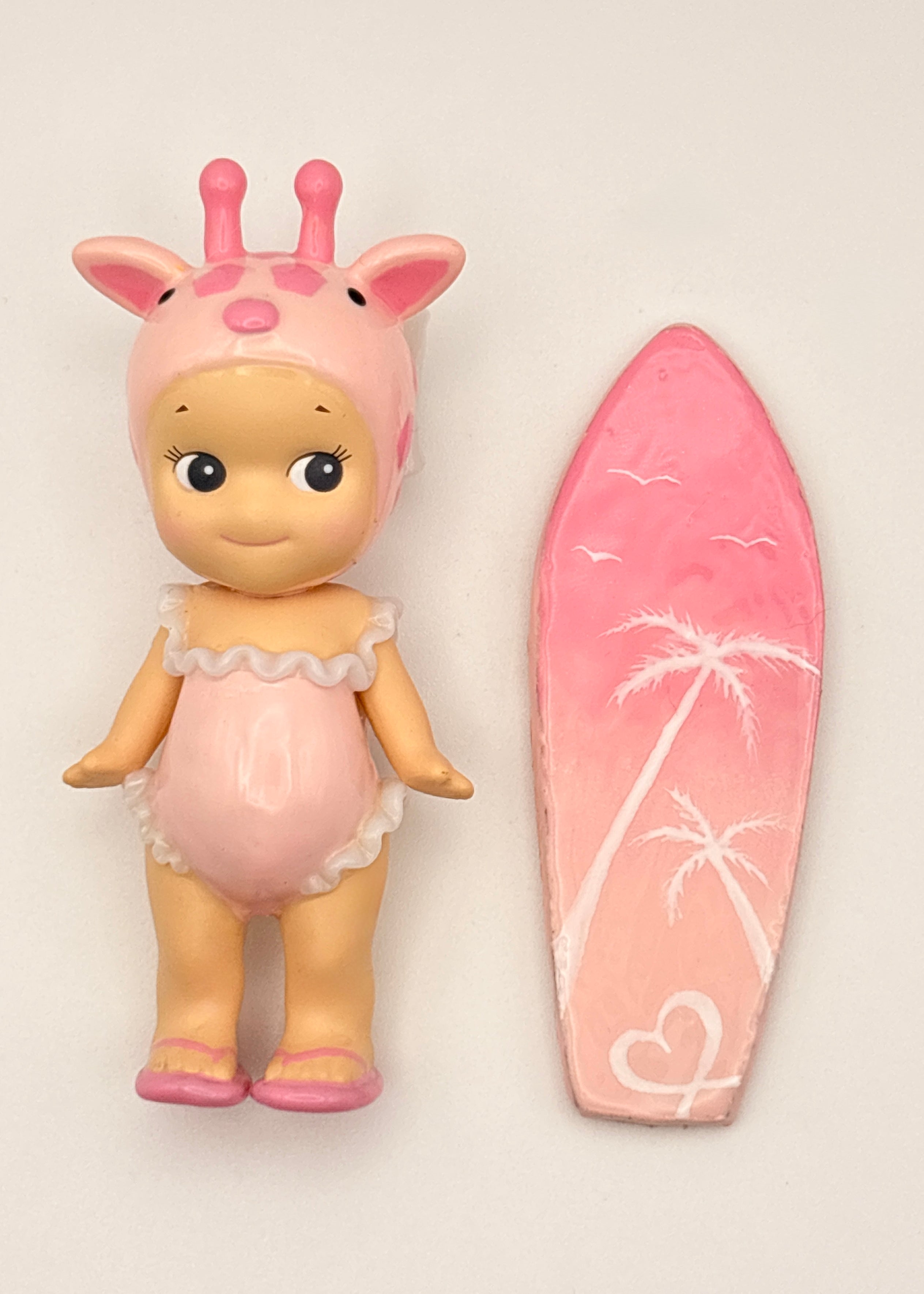 Pink Giraffe Surfer Figure