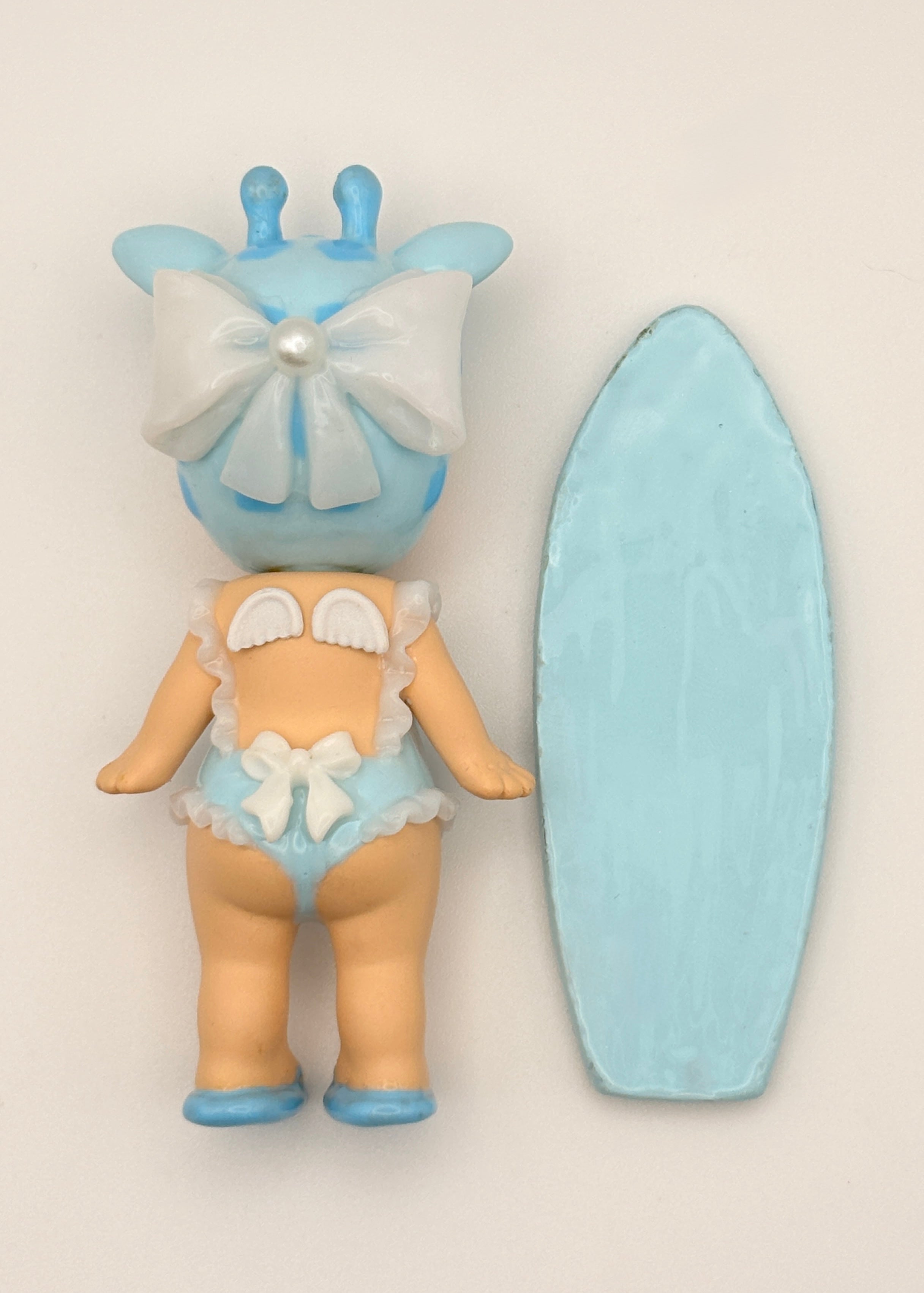 Blue Giraffe Surfer Figure