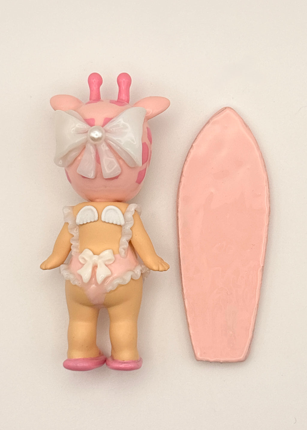 Pink Giraffe Surfer Figure