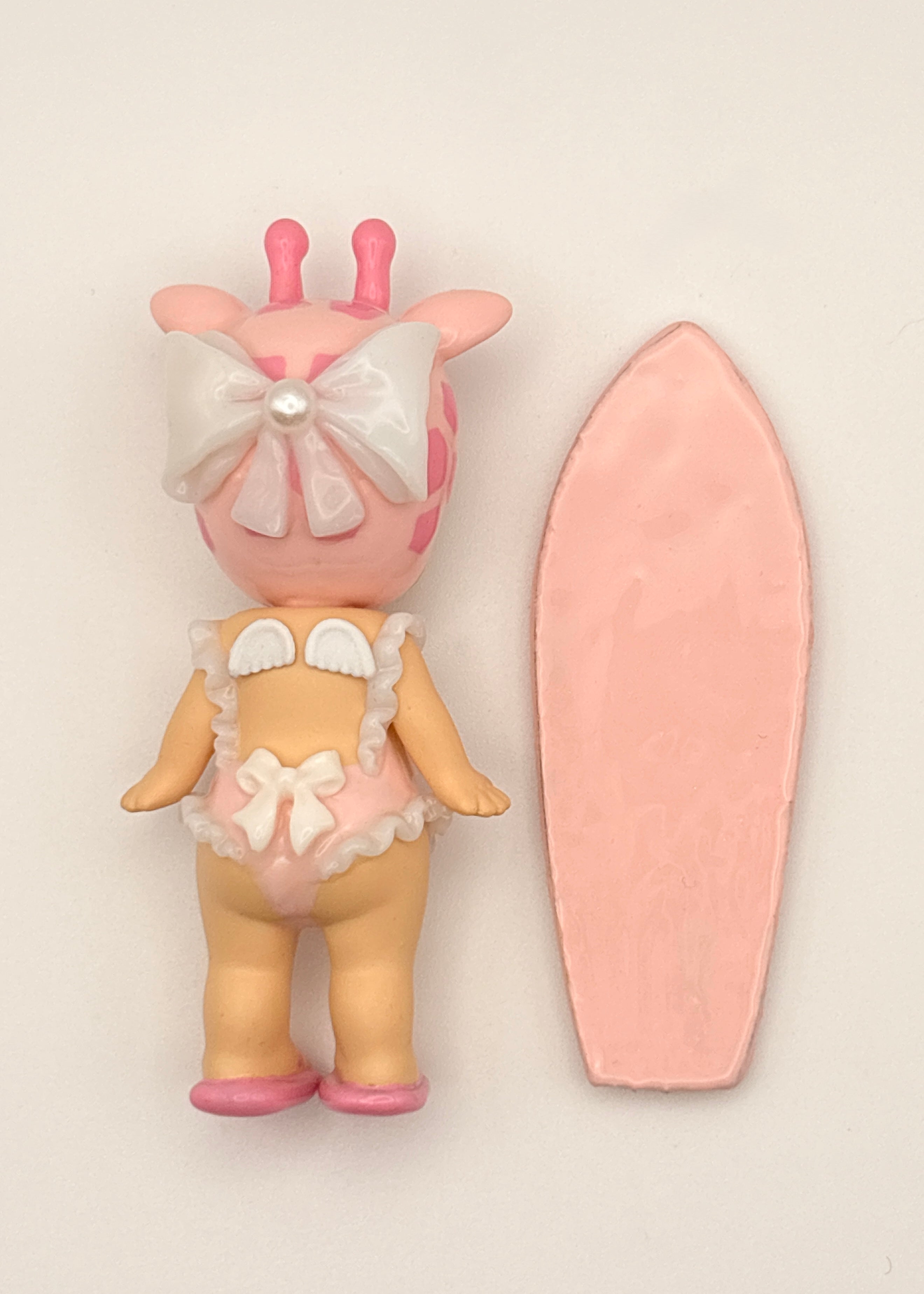 Pink Giraffe Surfer Figure